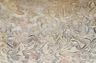Bas-relief of the battle of the gods and demons in the galleries of Angkor Wat