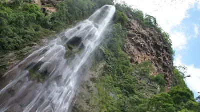 The Boca da Onça waterfall dropping into a forested gorge near Bodoquena