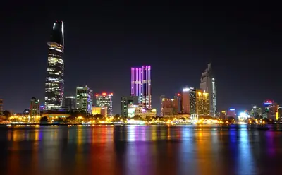 The Ho Chi Minh City skyline over the Saigon River at night