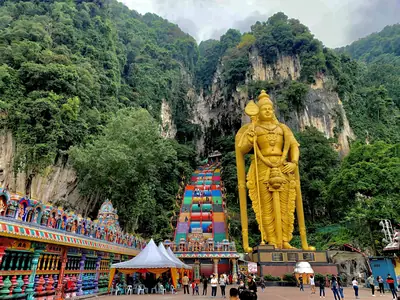The golden statue of Lord Murugan and the stairway at Batu Caves