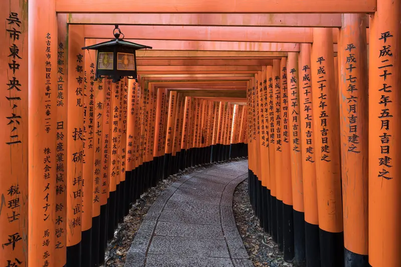 Rows of vermilion torii gates at Fushimi Inari Taisha, Kyoto