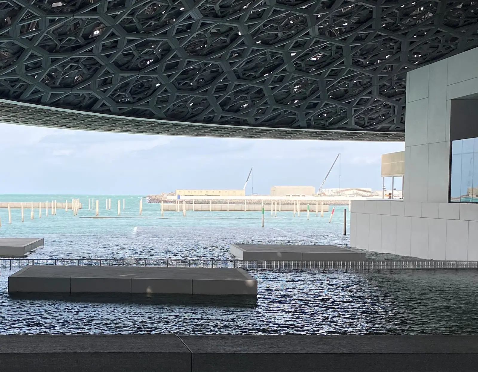 The dome of the Louvre Abu Dhabi over the water
