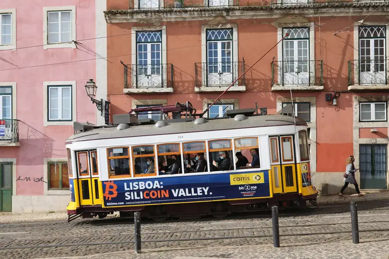 A yellow tram in the Alfama district, Lisbon