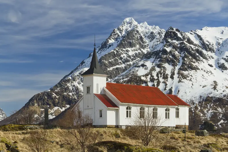 Sildpollnes Church and Higravstindan in morning, Austvågøya, Lofoten, Norway, April