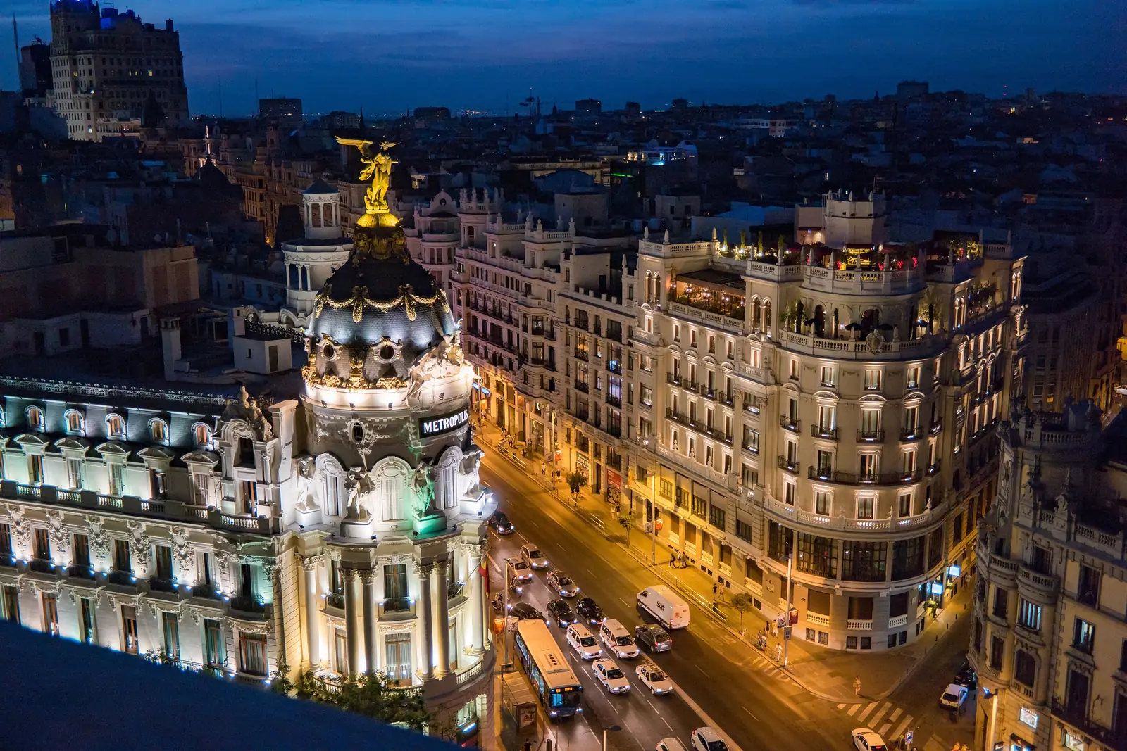 The Metrópolis building at the start of Gran Vía, Madrid, at dusk