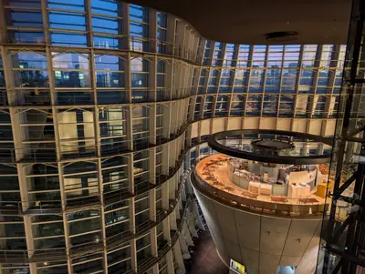 The atrium of the National Art Center, Tokyo, at dusk