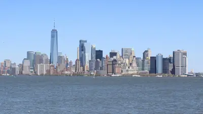 Lower Manhattan skyline seen across the harbour from Liberty Island