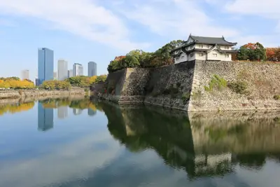 Osaka Castle above its outer moat with the Osaka Business Park towers behind