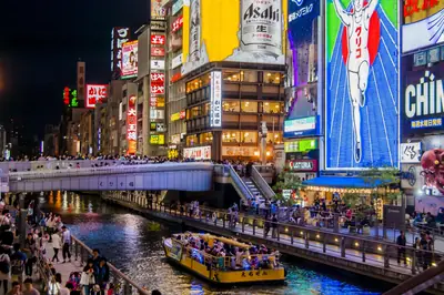 Neon signs along the Dōtonbori canal at Ebisu Bridge