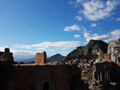 The ancient theatre of Taormina with Mount Etna behind