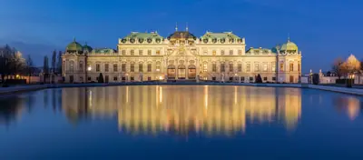 The Upper Belvedere reflected in its pool at dusk, Vienna